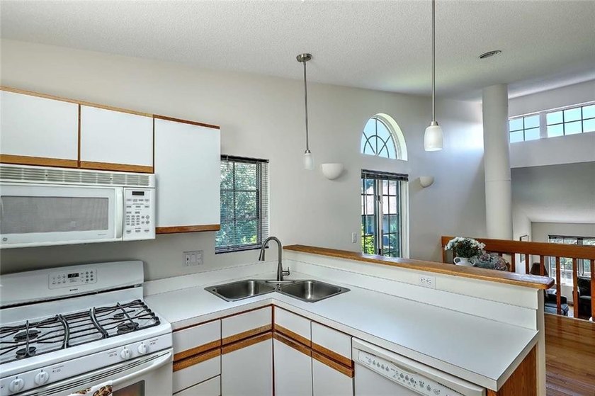 This well-maintained townhouse-style condominium is located in - photo 13