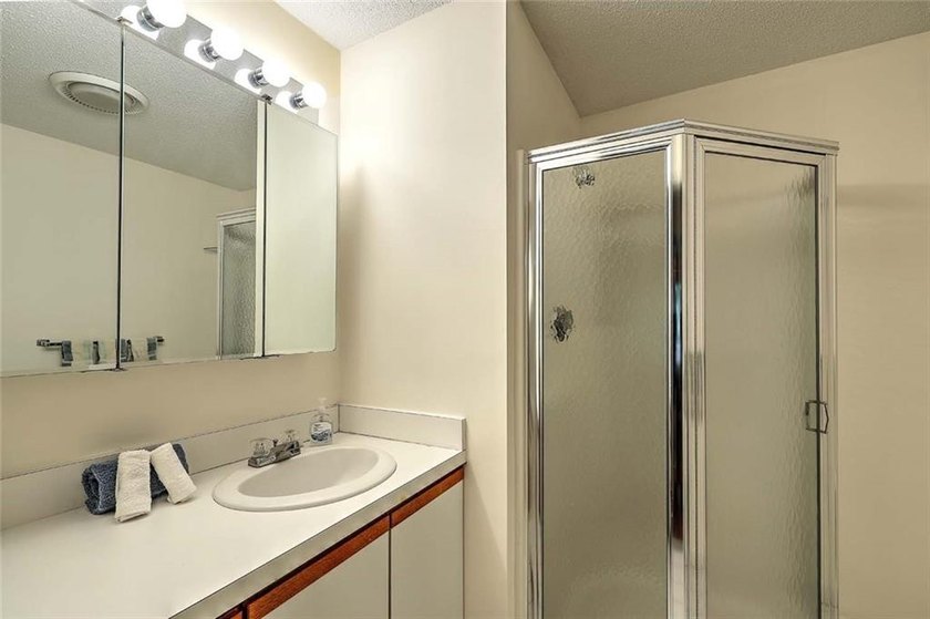 This well-maintained townhouse-style condominium is located in - photo 18