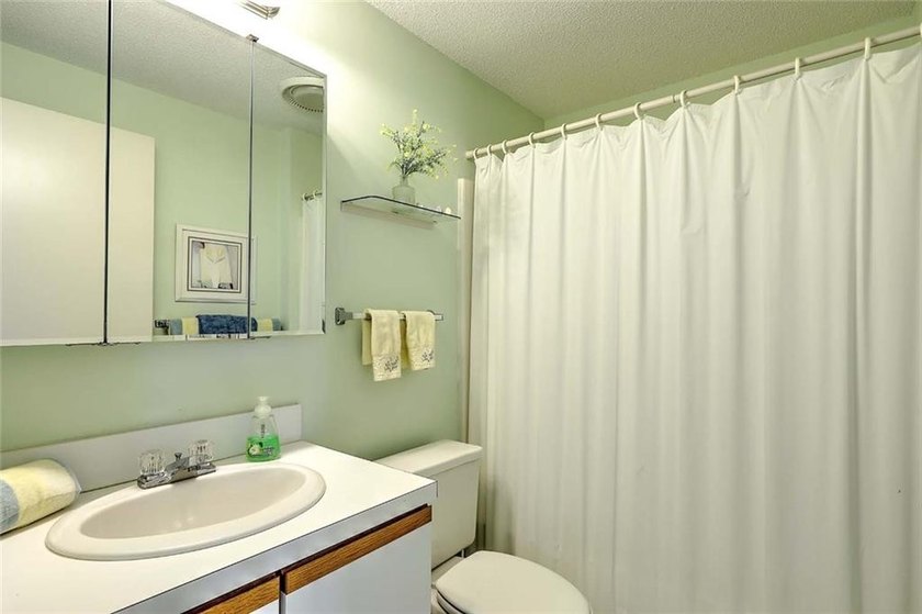 This well-maintained townhouse-style condominium is located in - photo 22
