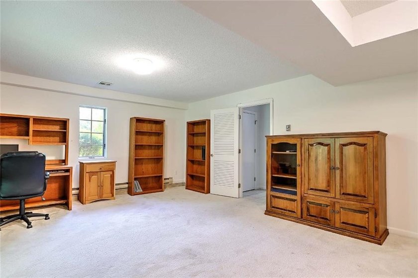 This well-maintained townhouse-style condominium is located in - photo 23