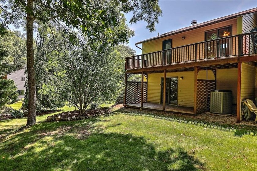 This well-maintained townhouse-style condominium is located in - photo 29