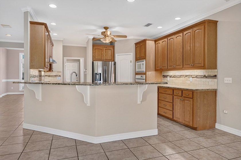 Nestled beneath a canopy of majestic oak trees and overlooking - photo 43