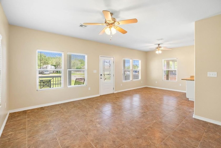 Situated on two spacious lots, this charming 3-bedroom, 2-bath - photo 11