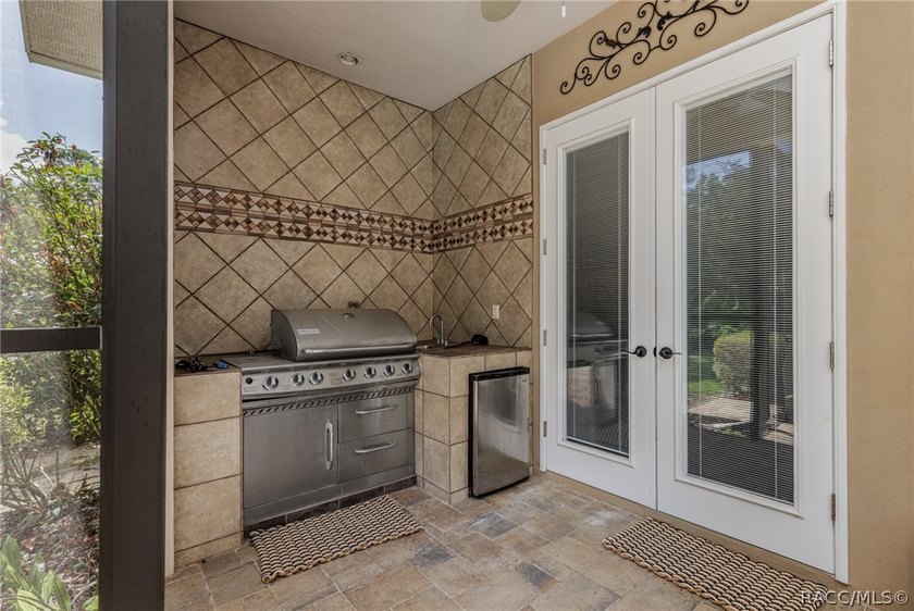 EXQUISTIE FLORIDA LIVING ABOUNDS IN THIS INVITING 3/2/2 WITH DEN - photo 33