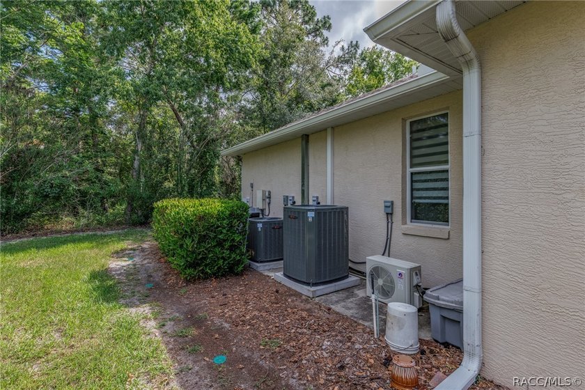 EXQUISTIE FLORIDA LIVING ABOUNDS IN THIS INVITING 3/2/2 WITH DEN - photo 45