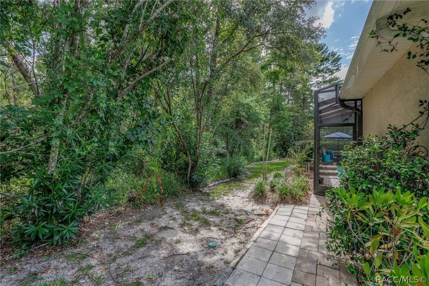 EXQUISTIE FLORIDA LIVING ABOUNDS IN THIS INVITING 3/2/2 WITH DEN - photo 47