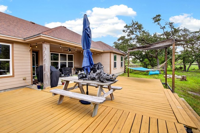 Welcome to Coastal Wild Wood, y'all! This 4-bedroom, 3-bath - photo 29