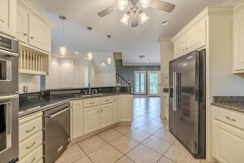 Welcome to this beautiful brick home perfectly situated on the - photo 11