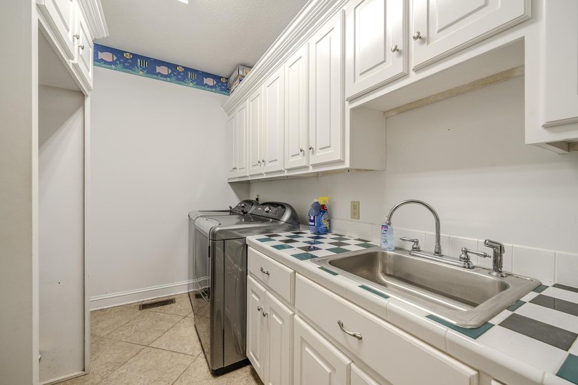 Welcome to this beautiful brick home perfectly situated on the - photo 25