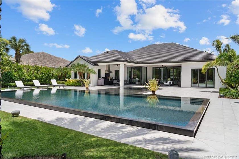 Welcome to this extraordinary waterfront estate in the gated - photo 3