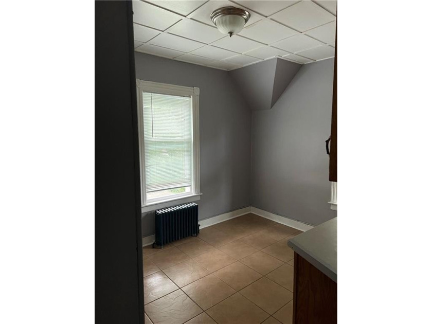 Welcome to this well-maintained 3 family home + 2 car garage - photo 13