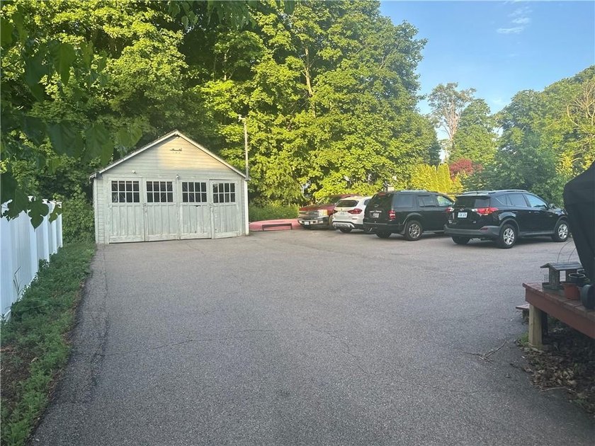 Welcome to this well-maintained 3 family home + 2 car garage - photo 19