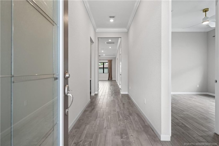 Welcome to this 2022 custom CBS home in Veranda Gardens. Prime - photo 9