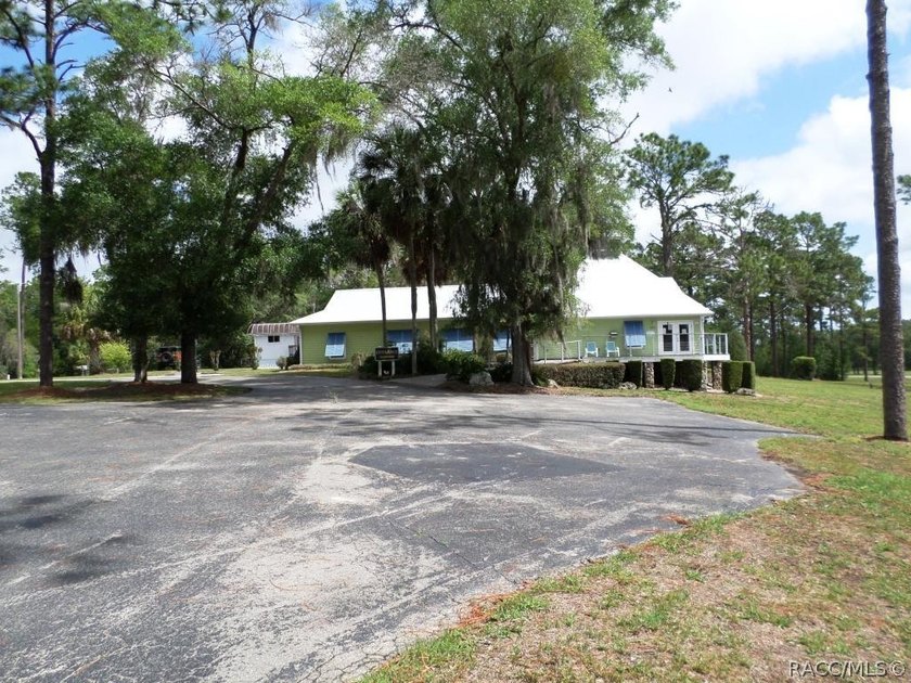 Situated centrally within the Rainbow Springs Community, this - photo 3