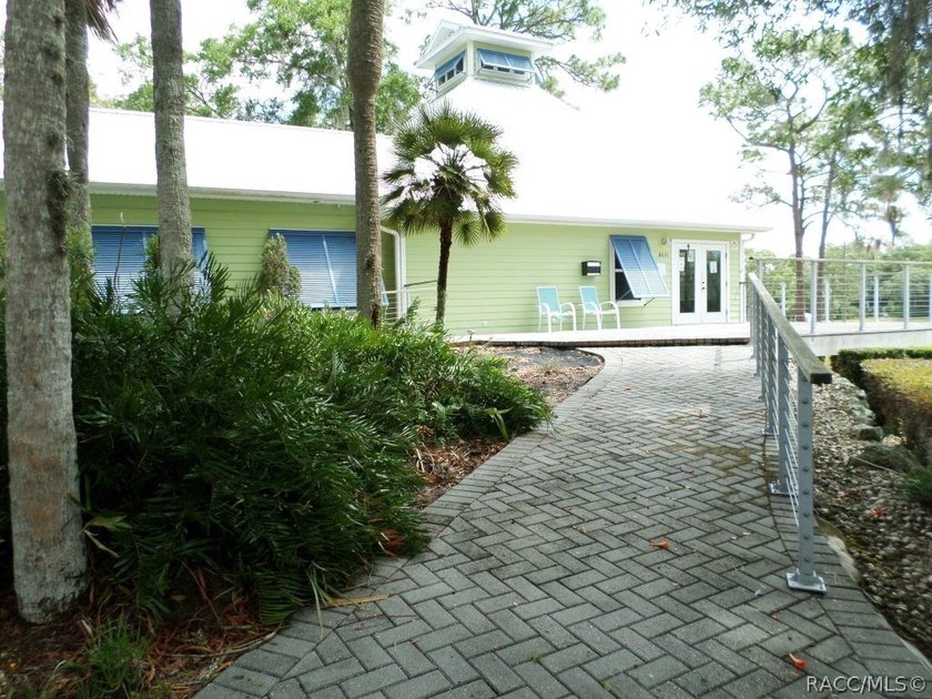 Situated centrally within the Rainbow Springs Community, this - photo 4