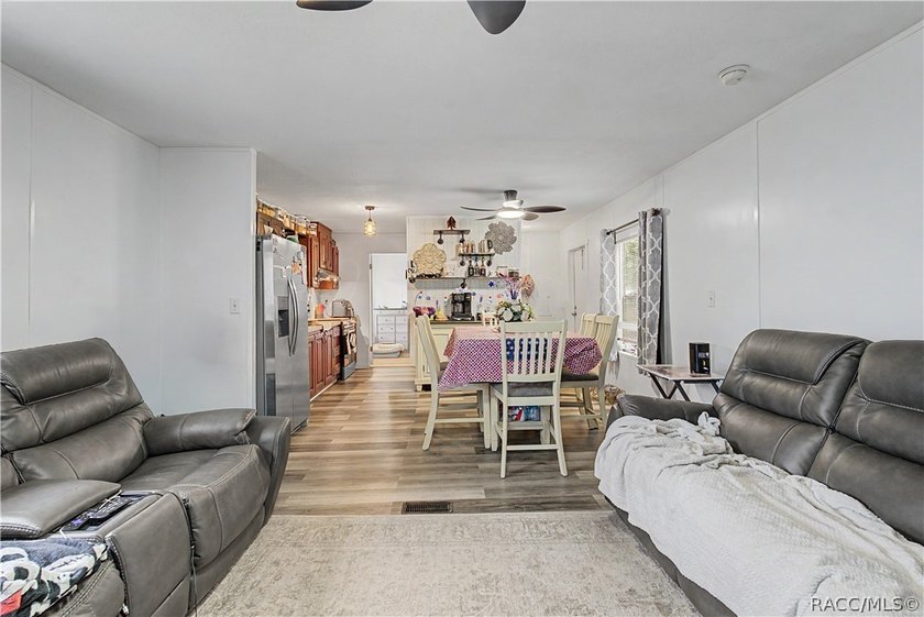 Step inside to find modern luxury vinyl plank (LVP) flooring - photo 3