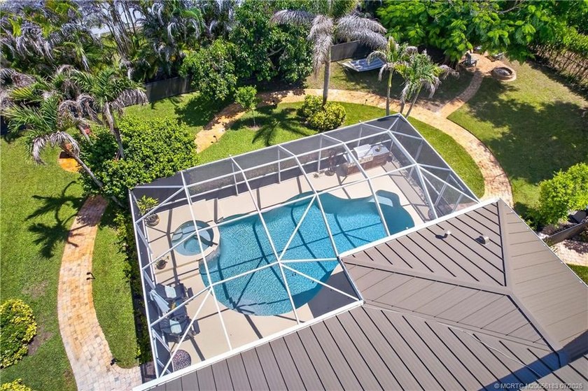 Discover a backyard you'll never want to leave. Winding paver - photo 8