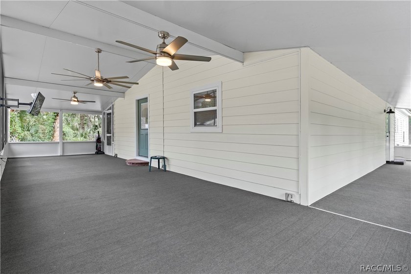 Tucked away on a beautiful wooded 1-acre waterfront lot in the - photo 7