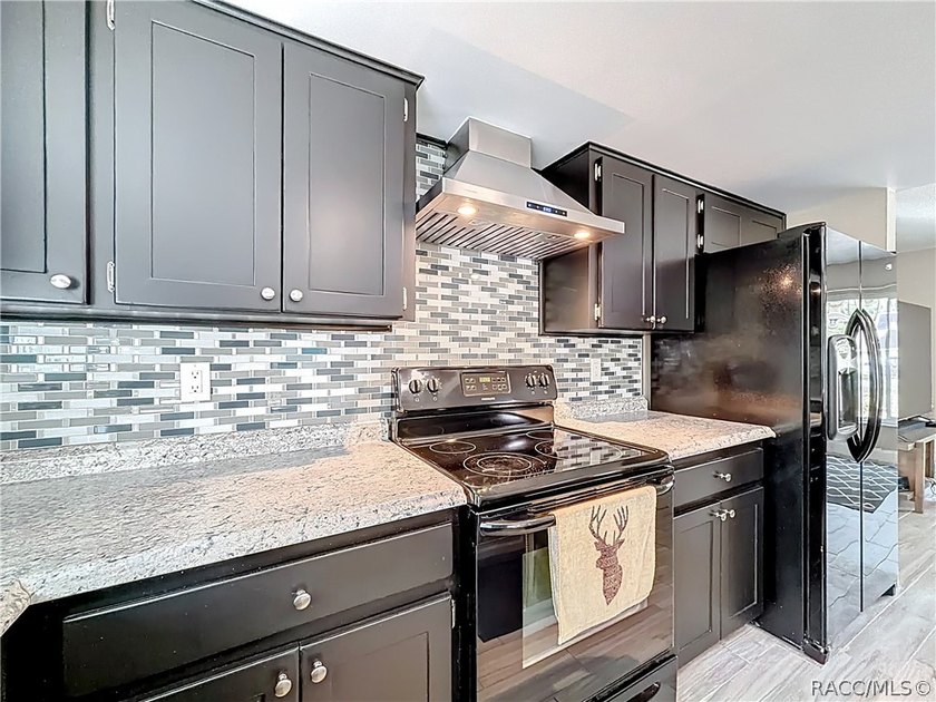 This updated 2-bedroom, 2-bathroom home at 11 Sweetgum Court - photo 7