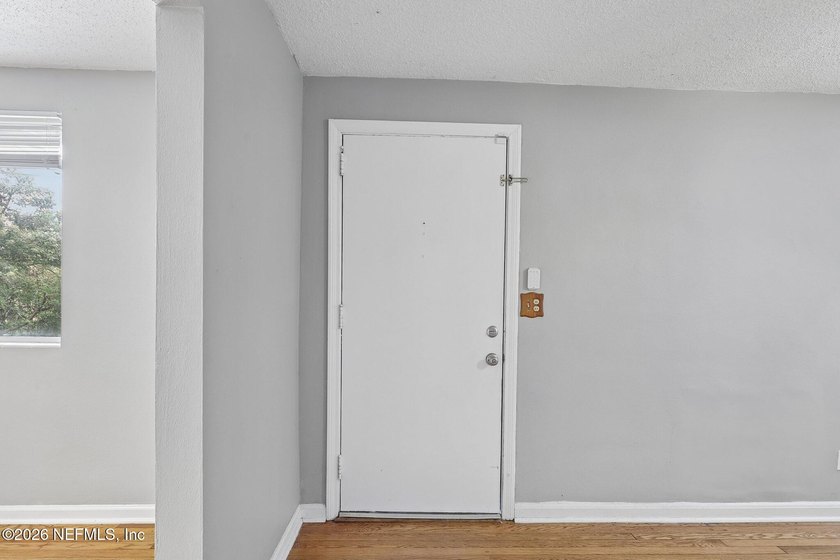 As you enter this well maintained home on a quiet street, the - photo 7