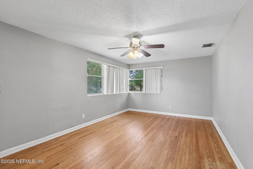 As you enter this well maintained home on a quiet street, the - photo 8