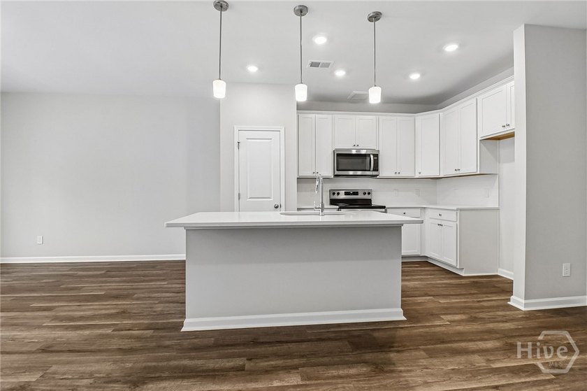 Welcome home to 20 Hidden Pointe Drive! This three-story - photo 8