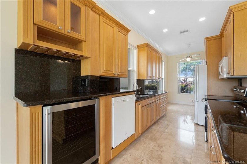 Located in the guard-gated community of The Meadows in Palm City - photo 7