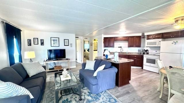 This charming 2-bedroom, 1.5-bath manufactured home offers - photo 3