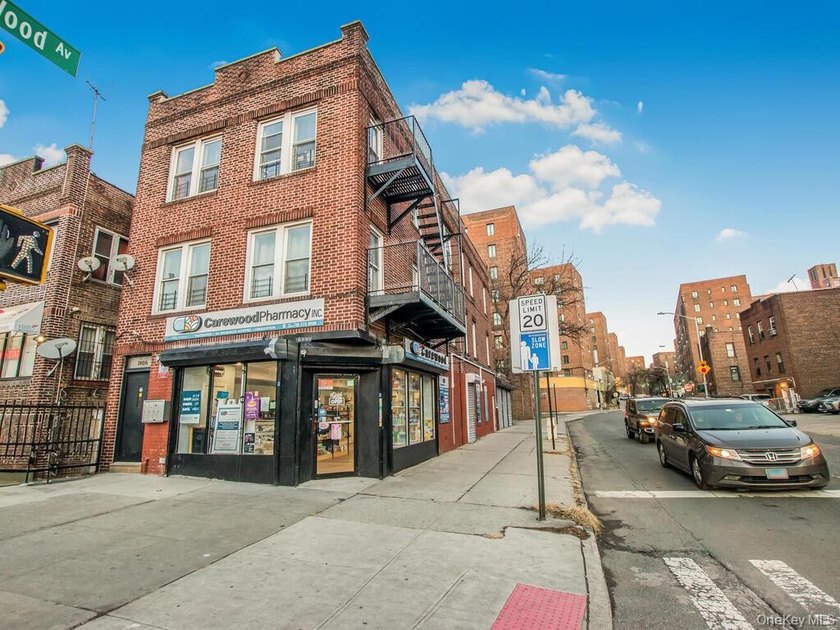 Detached brick mixed-use building with R6 zoning located on busy - photo 5
