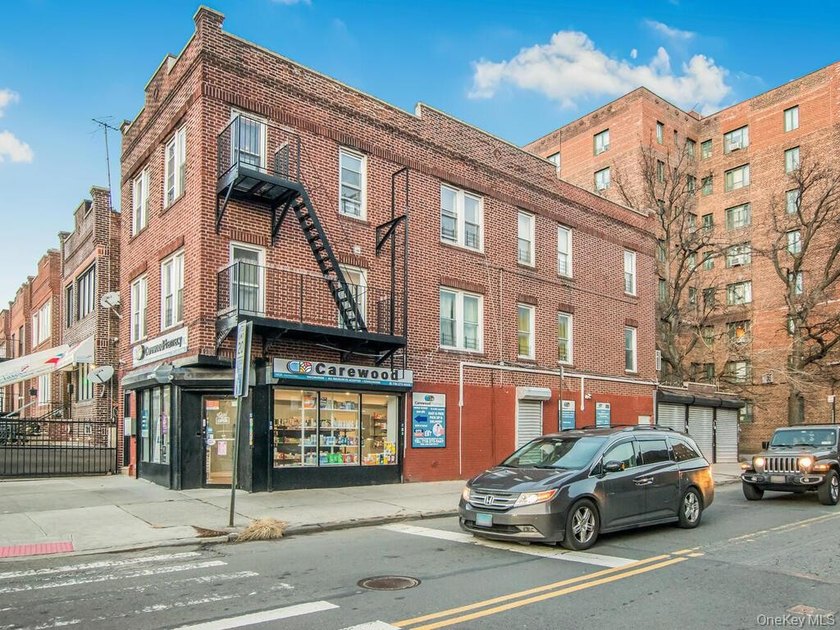 Detached brick mixed-use building with R6 zoning located on busy - photo 6