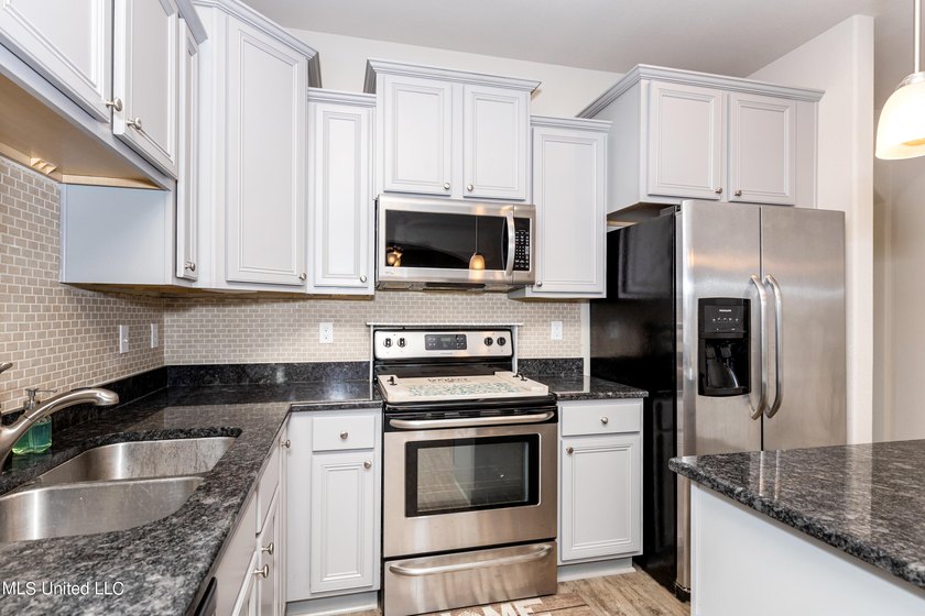 Welcome home to this charming 3-bedroom, 2-bath home in one of - photo 17