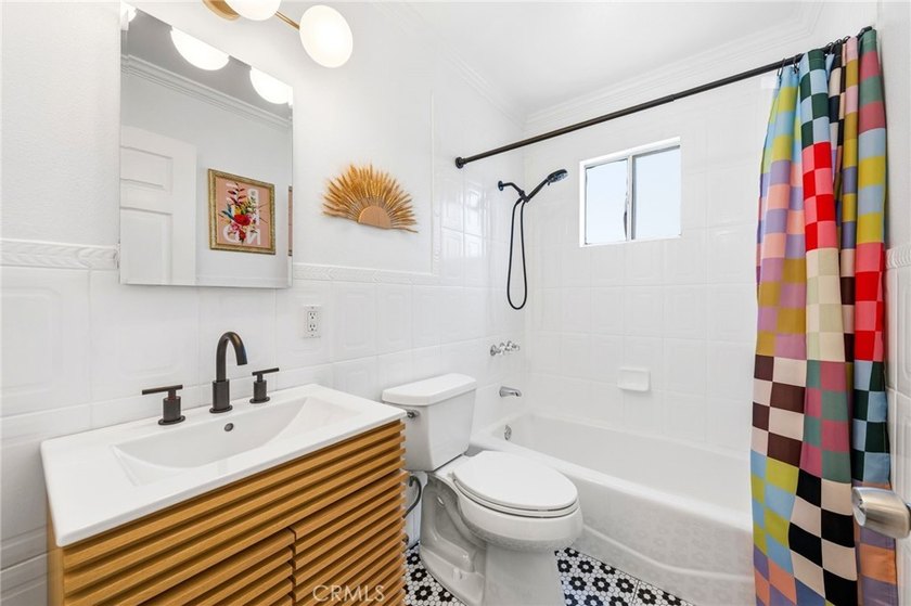 Welcome home to one of the most stylishly designed homes on the - photo 11