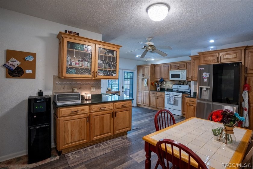 Beautifully maintained 4-bedroom, 2-bath pool home in the - photo 9