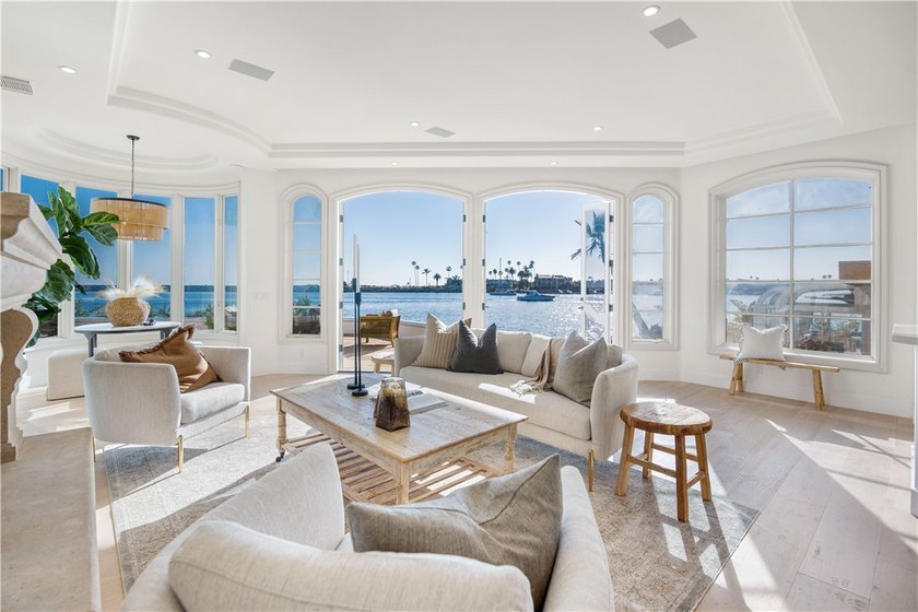 Overlooking the channel entrance, this waterfront home is - photo 3
