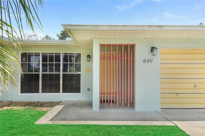 Mid-century modern charm abounds in this CBS home that features - photo 2