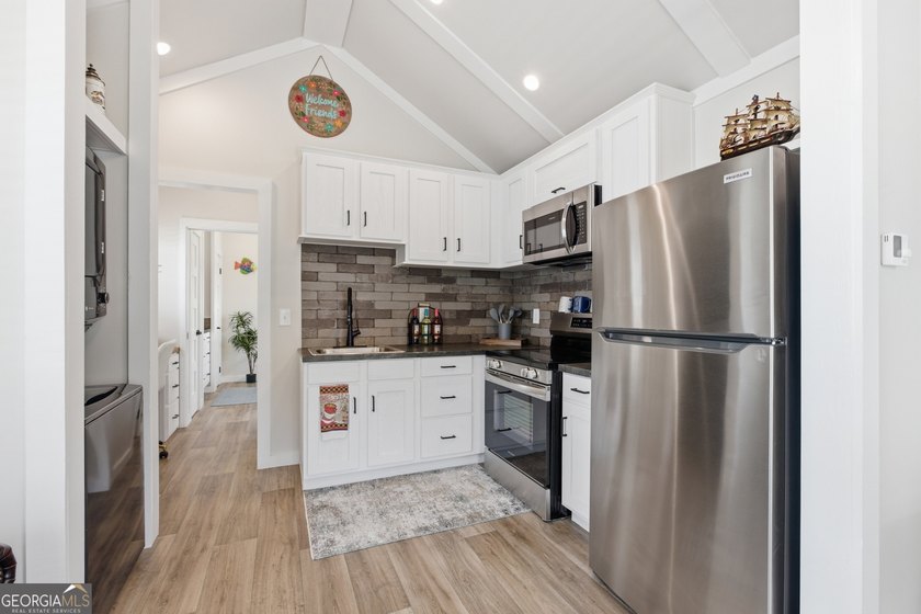Simple living meets modern comfort in this Wayah model tiny home - photo 11