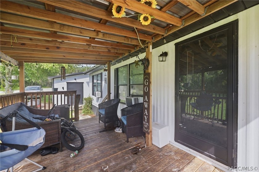 Located on a 0.19-acre corner lot in Floral City, this - photo 3