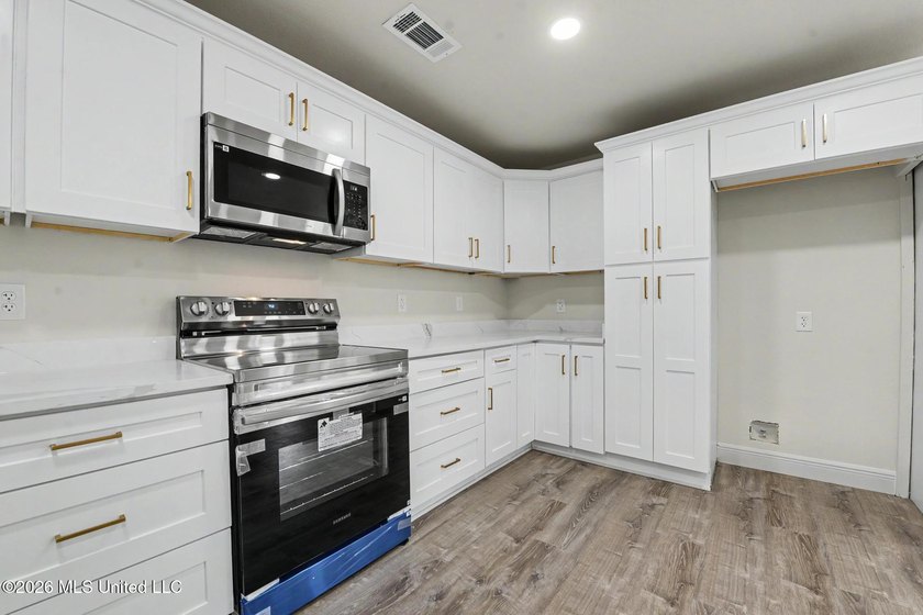 What a beautifully remodeled home on two lots with a metal - photo 11
