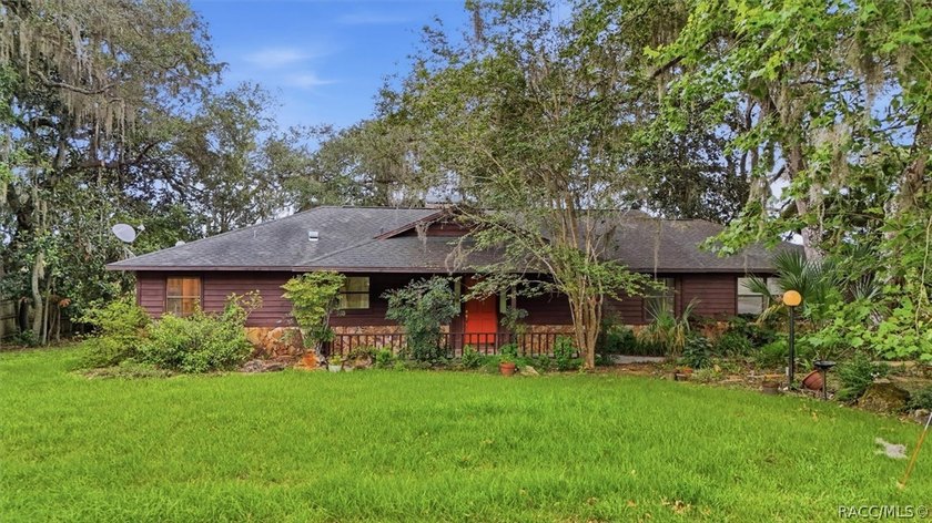 Nestled beneath a canopy of majestic oak trees and overlooking - photo 3