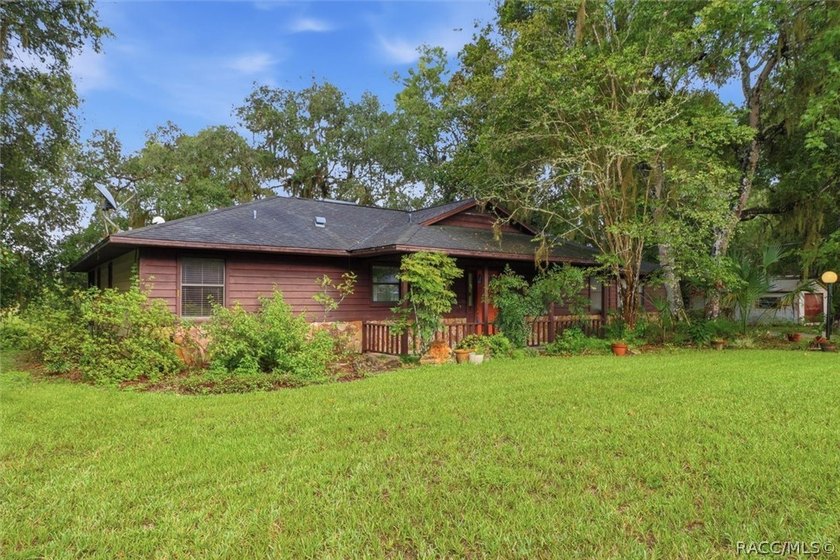 Nestled beneath a canopy of majestic oak trees and overlooking - photo 4
