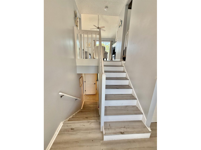 Updated townhome with new grey weathered-looking LVP flooring - photo 28