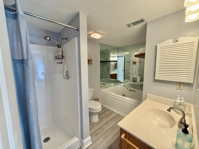 Updated townhome with new grey weathered-looking LVP flooring - photo 35