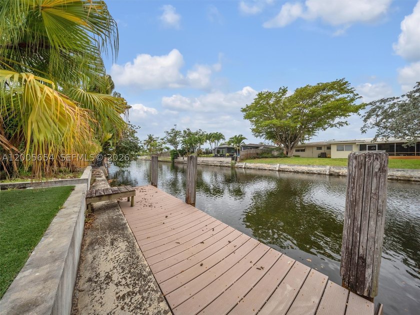 Large and Updated canal front pool home with dock on oversized - photo 31