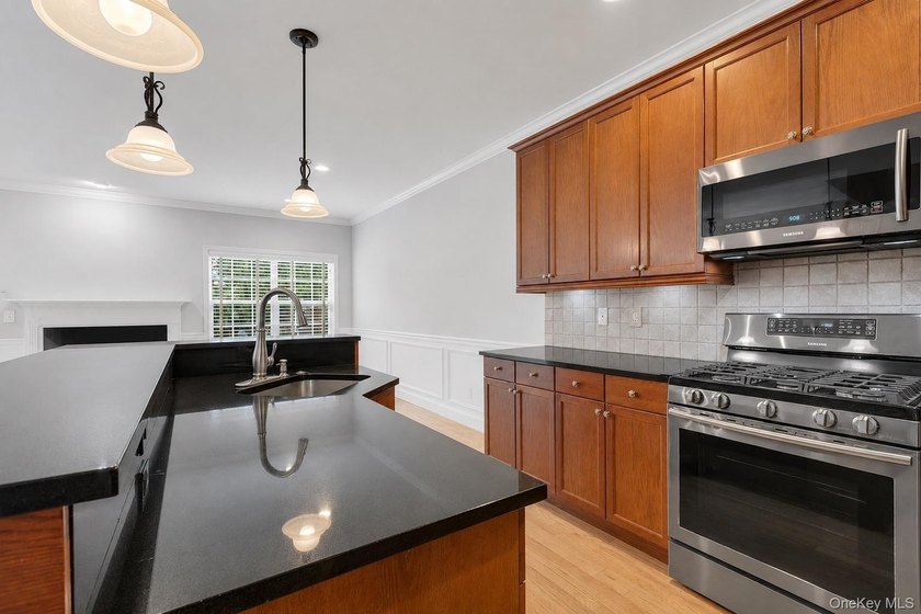 Tucked within the heart of vibrant Patchogue Village, this - photo 15