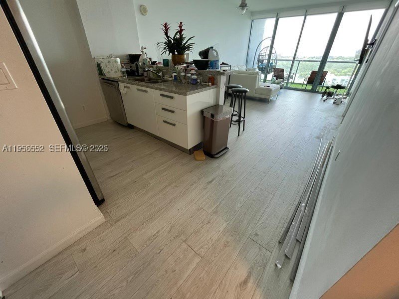 Experience modern luxury living at The Blue Condo. Wake up to - photo 2