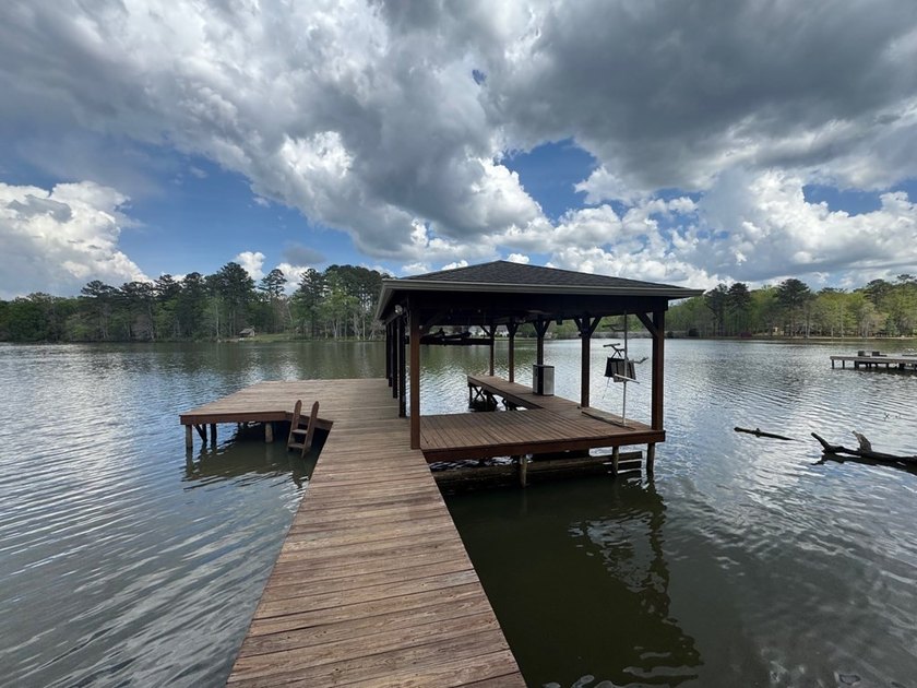 Set on nearly 100 acres of beautiful Golden Pond with easy - photo 3