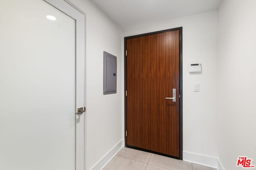 Stunning newer contemporary condo right across the street from - photo 3