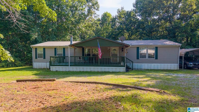 TUCKED away with privacy, this home sits on 3 acres with room to - photo 2