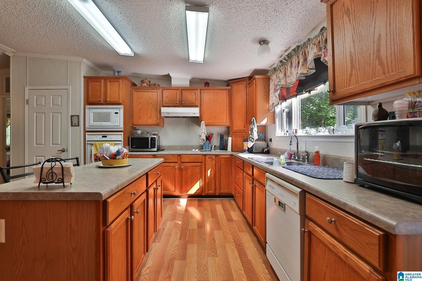 TUCKED away with privacy, this home sits on 3 acres with room to - photo 5