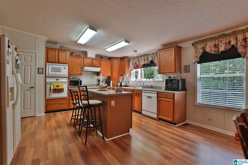 TUCKED away with privacy, this home sits on 3 acres with room to - photo 8